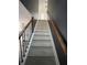 Long view up the carpeted staircase with wood and wrought iron at 5928 Cobblestone Creek Cir, Mableton, GA 30126