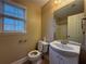 Bathroom features a white vanity and a shower-tub combination at 1007 Burton Nw Ct, Kennesaw, GA 30152