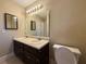 Bathroom with double sink vanity, large mirror, and tile flooring at 1007 Burton Nw Ct, Kennesaw, GA 30152