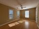 Spacious bedroom with hardwood floors, two windows, and ample natural light at 1007 Burton Nw Ct, Kennesaw, GA 30152