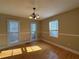 Cozy dining room featuring hardwood floors and a stylish chandelier fixture at 1007 Burton Nw Ct, Kennesaw, GA 30152