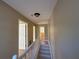 Upstairs hallway with white railing and neutral colored walls and trim at 1007 Burton Nw Ct, Kennesaw, GA 30152