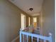 Upstairs hallway with white railing and neutral colored walls and trim at 1007 Burton Nw Ct, Kennesaw, GA 30152