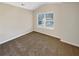 Cozy carpeted bedroom with a window for natural light, offering a relaxing space at 1181 Paramount Dr, Mcdonough, GA 30253