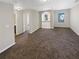 Upstairs bonus room with plush carpeting and natural light from the windows at 1181 Paramount Dr, Mcdonough, GA 30253