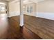 Bright living room with dark wood flooring, plush carpeting, and decorative wall trim at 1181 Paramount Dr, Mcdonough, GA 30253