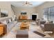 Bright living room featuring neutral paint colors, modern furniture and a fireplace at 1181 Paramount Dr, Mcdonough, GA 30253