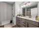 Bathroom featuring double vanity, with a large mirror, dark hardware and neutral walls at 236 Himalaya Way Way, Mcdonough, GA 30253