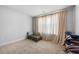 Bedroom with neutral carpet, light-filled windows with curtains, and neutral paint at 236 Himalaya Way Way, Mcdonough, GA 30253