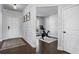 Inviting entryway with dark hardwood floors leads to a home exercise space at 236 Himalaya Way Way, Mcdonough, GA 30253