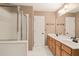 Bathroom with double sink vanity, walk-in shower, and a separate linen closet at 239 Valley Xing, Canton, GA 30114