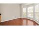 Inviting dining area with gleaming hardwood floors and sun-filled bay windows at 239 Valley Xing, Canton, GA 30114