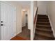 Inviting entryway featuring neutral walls and carpeted stairs, illuminated by recessed lighting at 239 Valley Xing, Canton, GA 30114