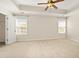 Large main bedroom with tray ceiling, plush carpeting, and natural light at 239 Valley Xing, Canton, GA 30114