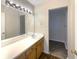 Well-lit bathroom featuring a spacious vanity and large mirror at 2721 Arctic Ct, Morrow, GA 30260