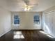 Bedroom with ceiling fan, two windows, and closet; bright and airy at 2721 Arctic Ct, Morrow, GA 30260