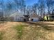 Single-story home with attached garage and charming front yard at 2721 Arctic Ct, Morrow, GA 30260