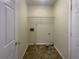 Functional laundry room with tile flooring and ample storage space at 2721 Arctic Ct, Morrow, GA 30260