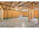 Spacious unfinished basement with exposed wooden framing and concrete flooring, ready for customization at 847 Sand Ln, Lawrenceville, GA 30045