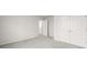 Empty bedroom with gray carpet and double door closet at 847 Sand Ln, Lawrenceville, GA 30045