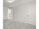 Bedroom featuring neutral walls, gray carpet, and a doorway to another room at 847 Sand Ln, Lawrenceville, GA 30045