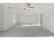 Spacious bedroom with a ceiling fan and neutral walls at 847 Sand Ln, Lawrenceville, GA 30045