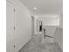 Hallway with neutral carpet and walls leading to multiple rooms at 847 Sand Ln, Lawrenceville, GA 30045