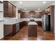 Modern kitchen featuring granite countertops, center island, and stainless steel appliances at 847 Sand Ln, Lawrenceville, GA 30045