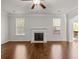 Sun-filled living room featuring a fireplace and views of the surrounding trees at 847 Sand Ln, Lawrenceville, GA 30045