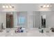 Bright bathroom with a double vanity, large mirror and view to shower, tub and water closet at 1077 Roanoke Ave, Mcdonough, GA 30253