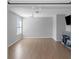 Neutral bedroom featuring recessed lights, hardwood flooring, a ceiling fan, and a large window at 1077 Roanoke Ave, Mcdonough, GA 30253