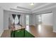 Open bedroom with hardwood flooring, neutral walls, recessed lighting, and large windows with privacy at 1077 Roanoke Ave, Mcdonough, GA 30253