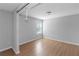 Bright bedroom featuring recessed lights, hardwood flooring, and a large window overlooking the front yard at 1077 Roanoke Ave, Mcdonough, GA 30253