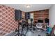 Bonus room featuring retro wallpaper and wood accent wall used as music room at 1077 Roanoke Ave, Mcdonough, GA 30253