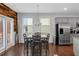 Dining area features stainless steel appliances, gray cabinetry, and sliding door access at 1077 Roanoke Ave, Mcdonough, GA 30253