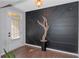Modern foyer with a decorative wall design, stylish lighting, and a sleek plant accent creating a welcoming entrance at 1077 Roanoke Ave, Mcdonough, GA 30253