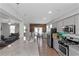 Modern, open-concept kitchen featuring stainless steel appliances, granite countertops, and a seamless flow to the dining area at 1077 Roanoke Ave, Mcdonough, GA 30253