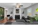 Spacious living room with fireplace, decorative wall art, and lots of natural light at 1077 Roanoke Ave, Mcdonough, GA 30253