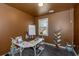 Home office with L-shaped desk, window with natural light, and custom wood shelving at 1077 Roanoke Ave, Mcdonough, GA 30253
