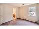 Bedroom featuring neutral walls and carpet and a window with backyard views at 2068 Bedford Ct, Lithonia, GA 30058
