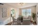 Cozy dining area with wood floors, a modern chandelier, and a view into the kitchen at 2068 Bedford Ct, Lithonia, GA 30058