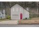 Charming two-story home with white siding, attached garage, and a beautifully colored front door at 2068 Bedford Ct, Lithonia, GA 30058