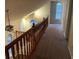 Hallway view with carpeted floors showcasing a ceiling fan at 2068 Bedford Ct, Lithonia, GA 30058