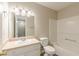 Bathroom featuring a vanity sink and cabinets with tile floors and a tub with shower at 2454 Brianna Dr, Hampton, GA 30228