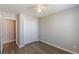 Bedroom features closet and entrance to the bathroom with hardwood floors and a ceiling fan at 2454 Brianna Dr, Hampton, GA 30228