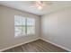 Bedroom featuring ample natural light from a window with a ceiling fan at 2454 Brianna Dr, Hampton, GA 30228