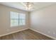 Bedroom featuring vinyl flooring, neutral walls, a ceiling fan and natural light at 2454 Brianna Dr, Hampton, GA 30228
