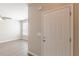 Bright entryway with wood-look floors and a window to the right, illuminated by a fan at 2454 Brianna Dr, Hampton, GA 30228