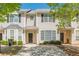 Inviting two-story townhouse with neutral siding and a well-kept front yard, perfect for comfortable living at 2454 Brianna Dr, Hampton, GA 30228