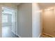 Hallway with vinyl flooring leading to a bedroom with natural light at 2454 Brianna Dr, Hampton, GA 30228